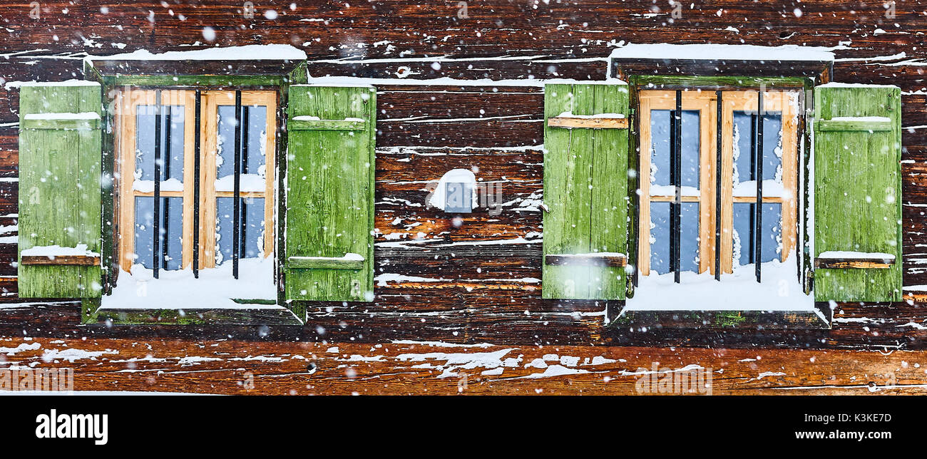 hut window with shutters, snowdrift, detail Stock Photo