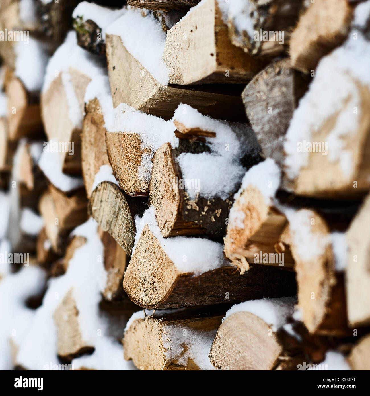 Firewood pile, winter, snow, detail, blur Stock Photo