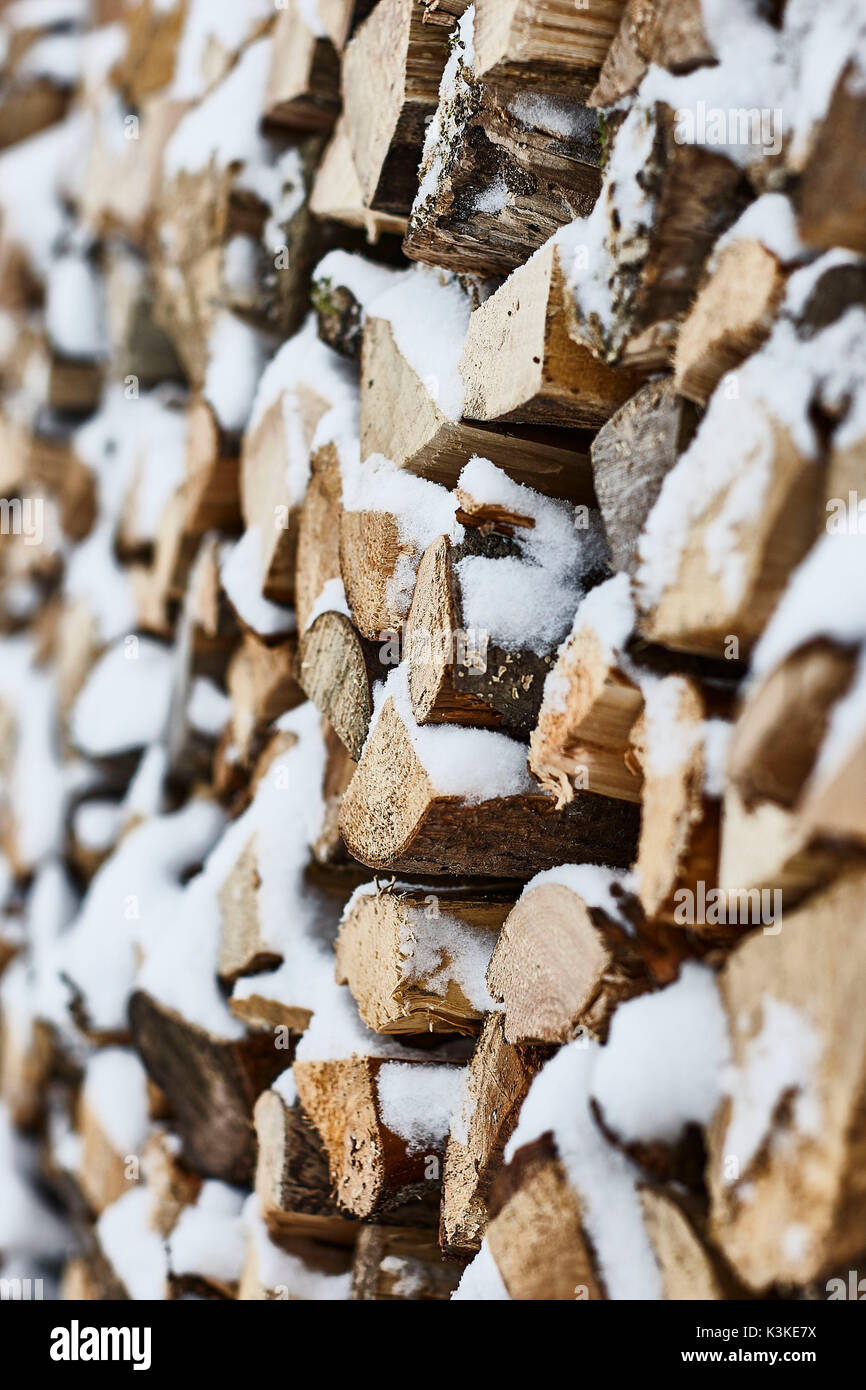 Firewood pile, winter, snow, detail, blur Stock Photo