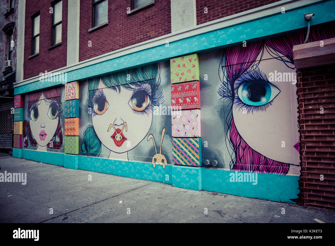 Graffiti and Street Art, big eyes girls, manga style, Manhatten, New York, USA Stock Photo