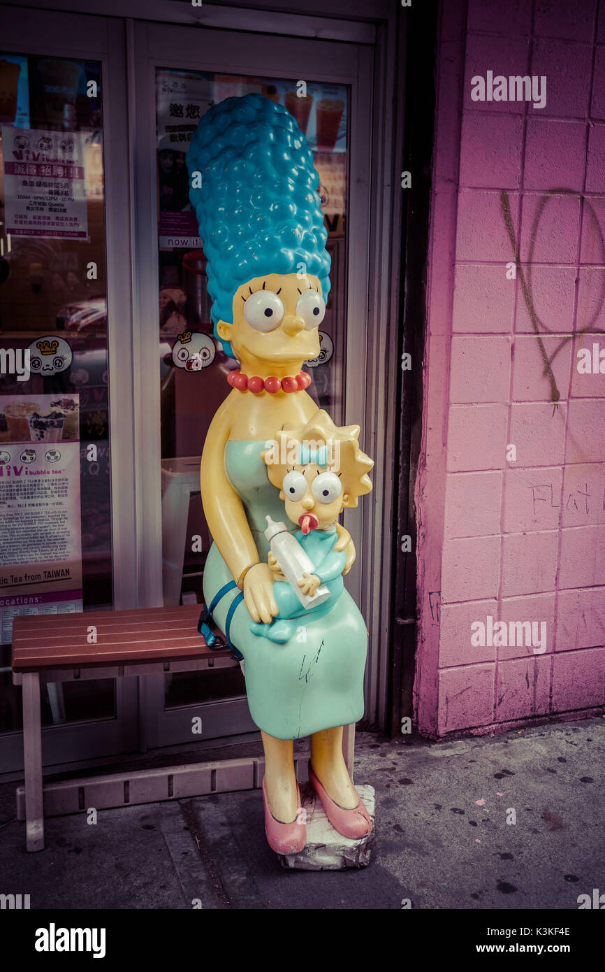 Maggie and Marge Simpson Figures sit on a bench, Manhatten, New York, USA Stock Photo
