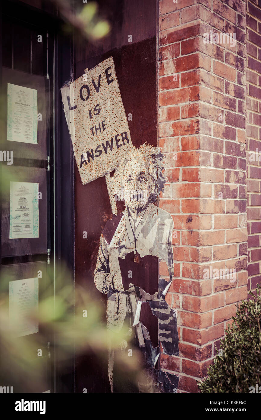 Einstein poster, Streetart, in a house entrance, 'Love is the answer', Chelsea, Art District, Manhatten, New York, USA Stock Photo