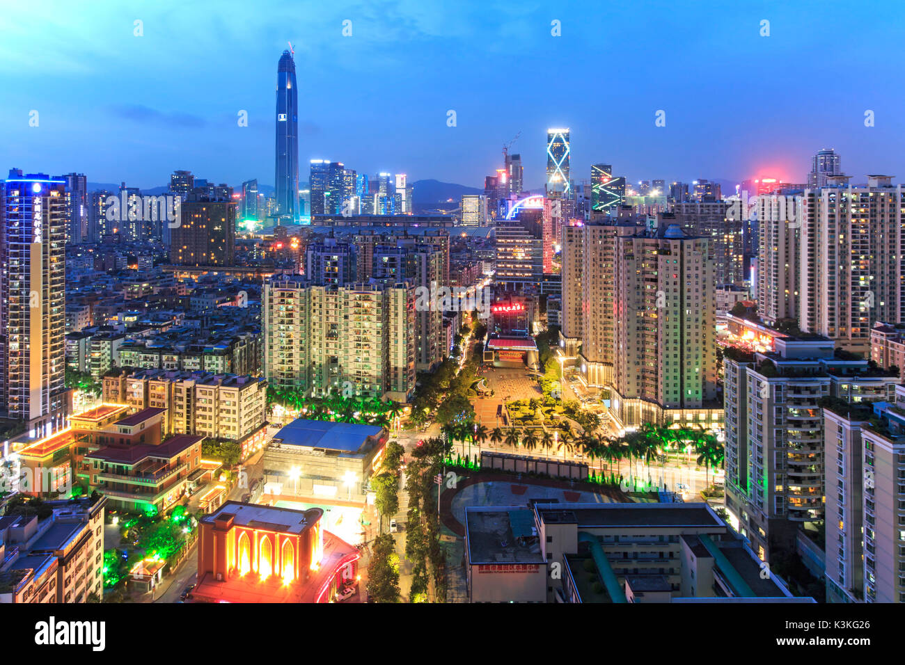 Shenzhen skyline at twilight with the tallest building of the city on background: the Ping An IFC, China Stock Photo