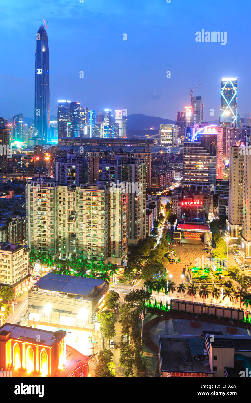Shenzhen skyline at twilight with the tallest building of the city on background: the Ping An IFC, China Stock Photo