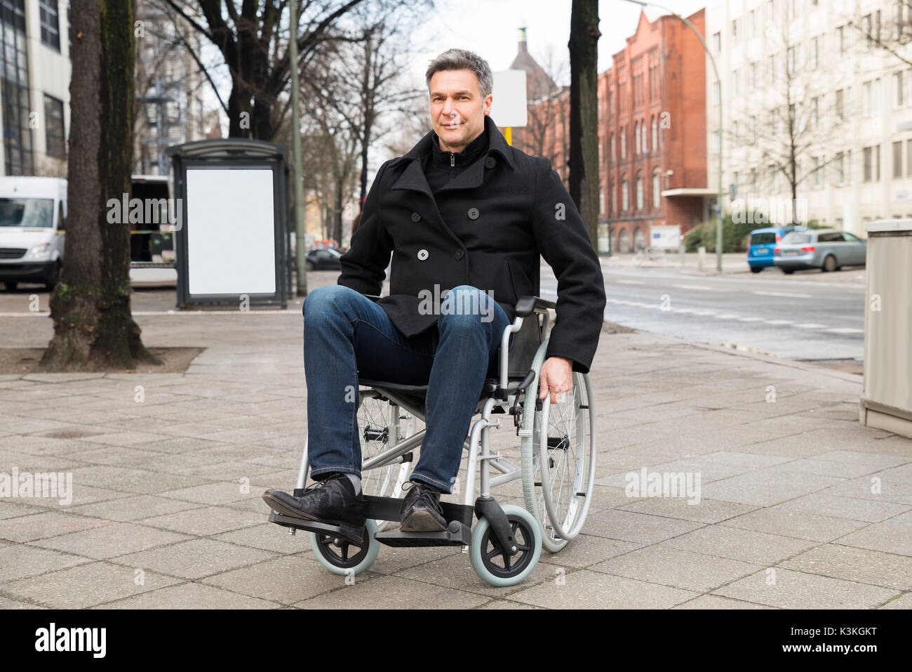 Sick man in a wheelchair hi-res stock photography and images - Alamy