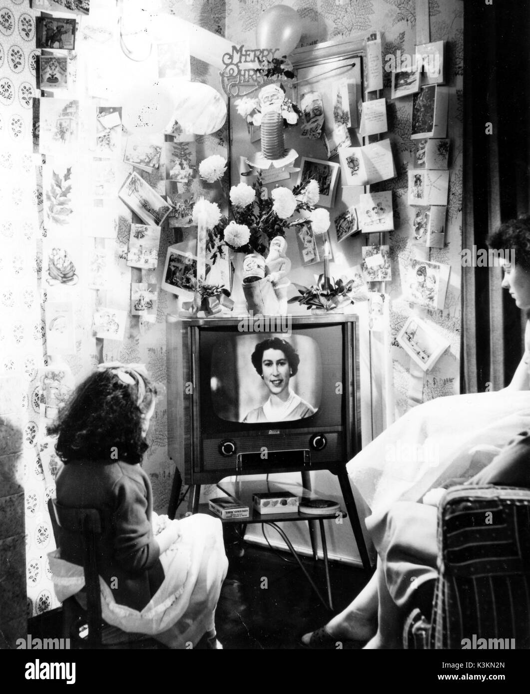WATCHING TELEVISION  - THE QUEEN'S CHRISTMAS MESSAGE TO THE NATION   C.1958 Stock Photo