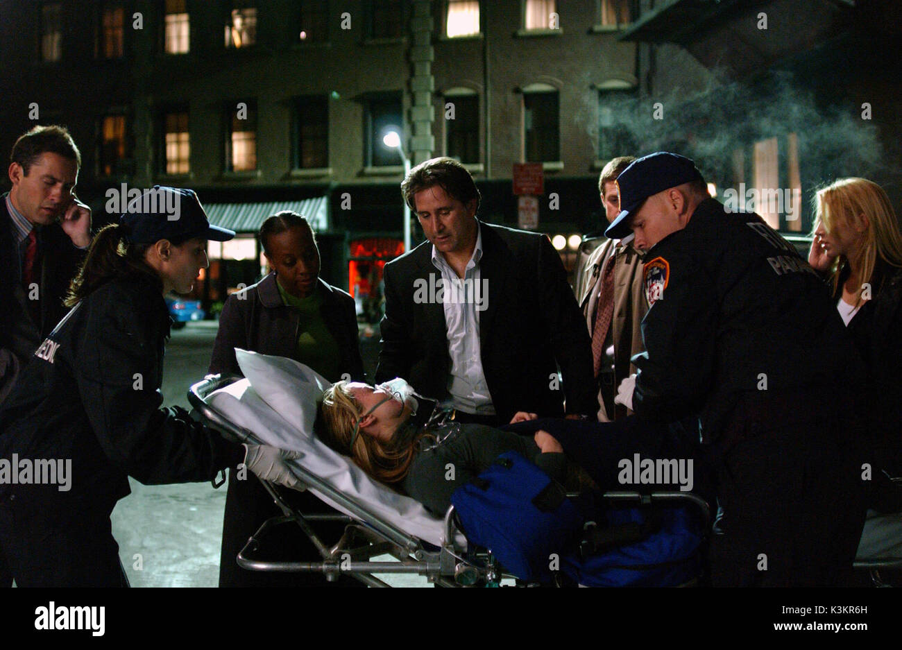 WITHOUT A TRACE [US 2002 - ]  Series,2 / Episode,5 / 'Copy Cat'  [L-R] ENRIQUE MURCIANO, [?], MARIANNE JEAN-BAPTISTE as Vivian Johnson, CLAIRE RANKIN as Doris [on gurney], ANTHONY LAPAGLIA as Jack Malone, ERIC CLOSE as Martin [obscured], [?], POPPY MONTGOMERY as Samantha         Date: 2002 Stock Photo