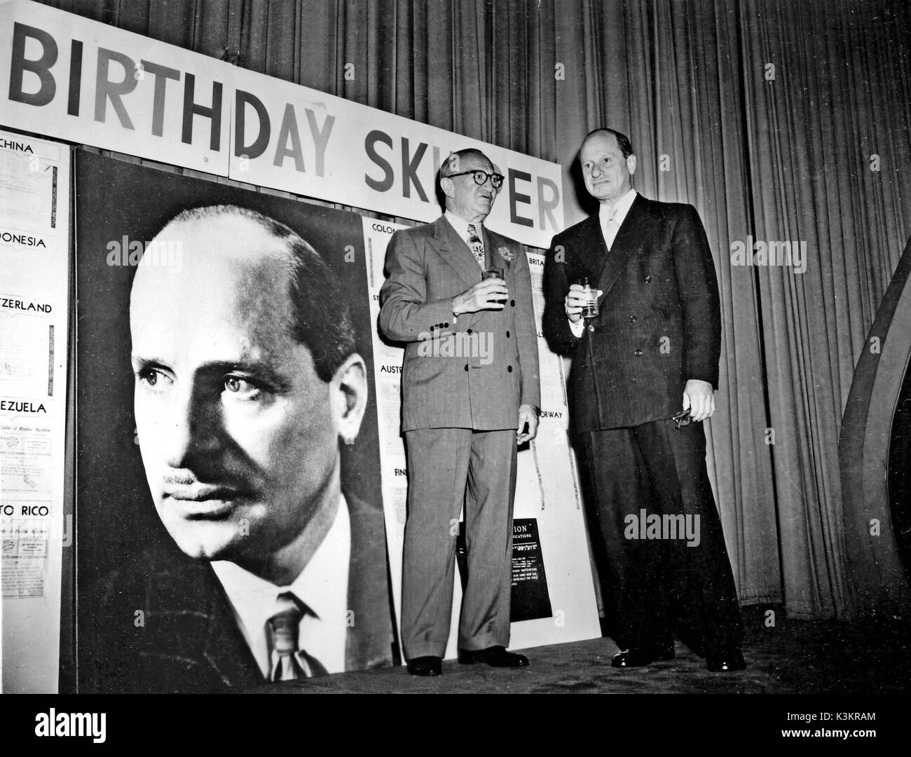 NICHOLAS M SCHENCK, president of Loew's Incorporated, the parent company of MGM, toasts Arthur M Loew at the surprise birthday party held for 'the Skipper' at the home office' Stock Photo