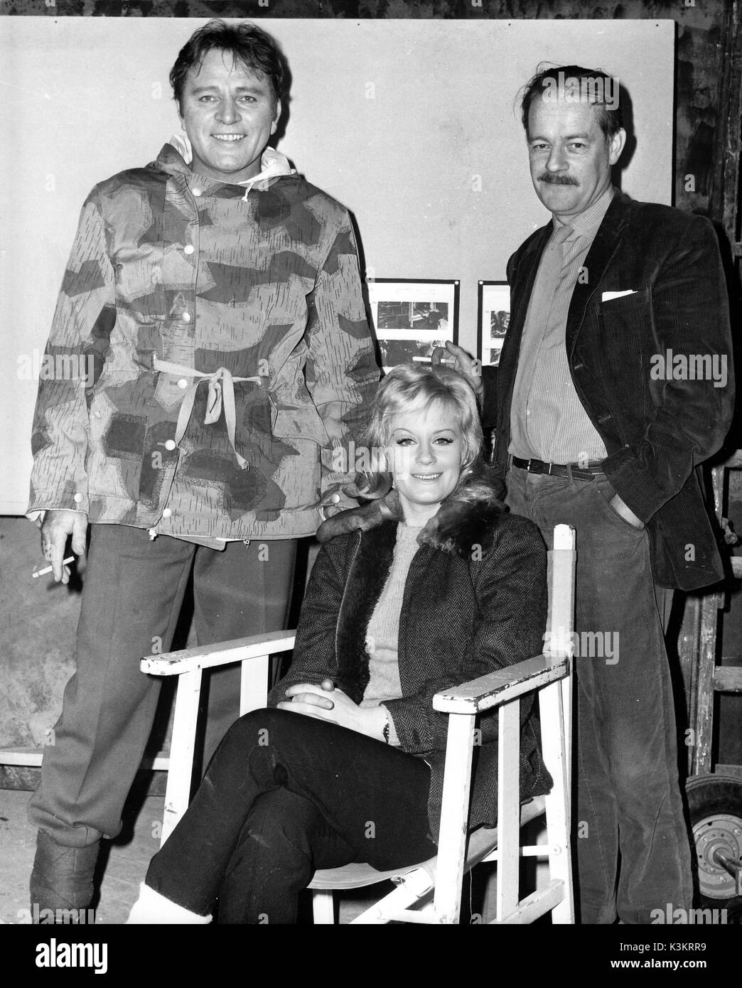 [L-R] RICHARD BURTON, MARY URE, writer ALISTAIR MACLEAN on the set of WHERE EAGLES DARE in 1968 Stock Photo