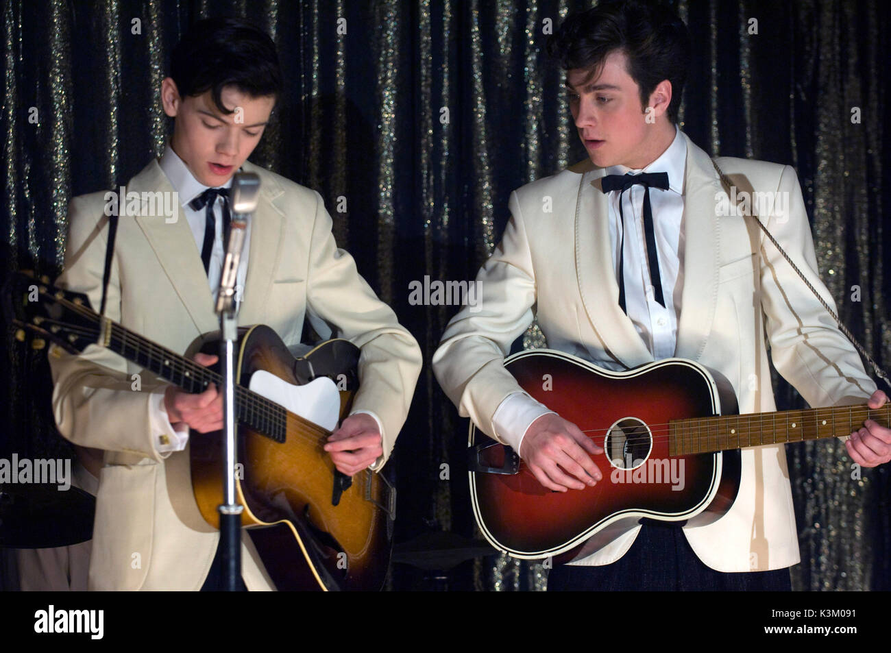 NOWHERE BOY THOMAS SANGSTER as Paul McCartney, AARON JOHNSON as John Lennon       Date: 2009 Stock Photo