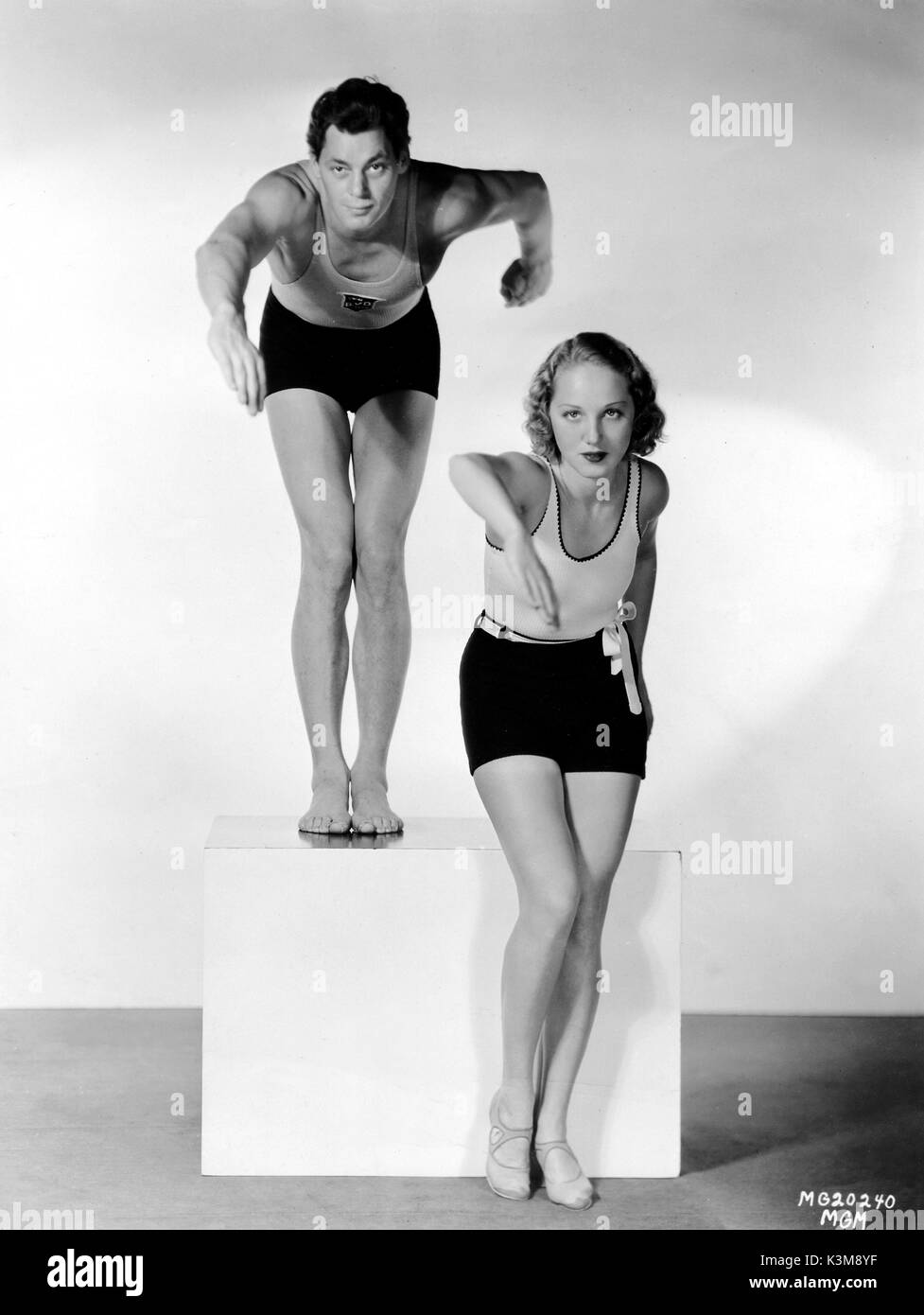 JOHNNY WEISSMULLER giving LEILA HYAMS a swimming lesson     Date: Stock Photo