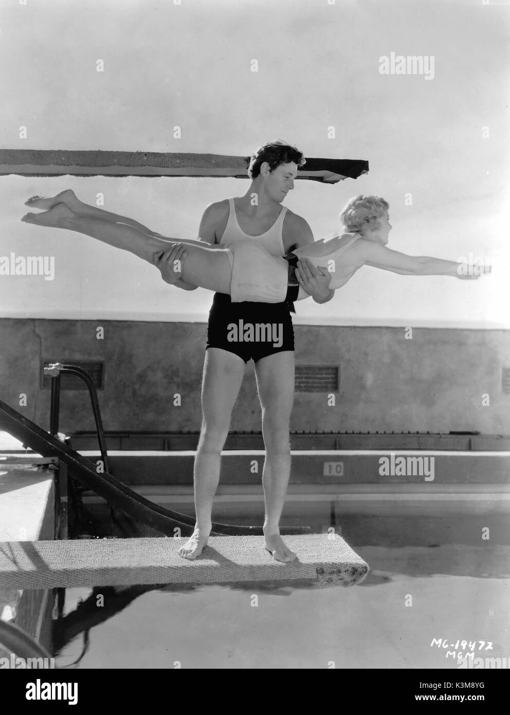JOHNNY WEISSMULLER ? giving UNA MERKEL a lesson in diving     Date: Stock Photo