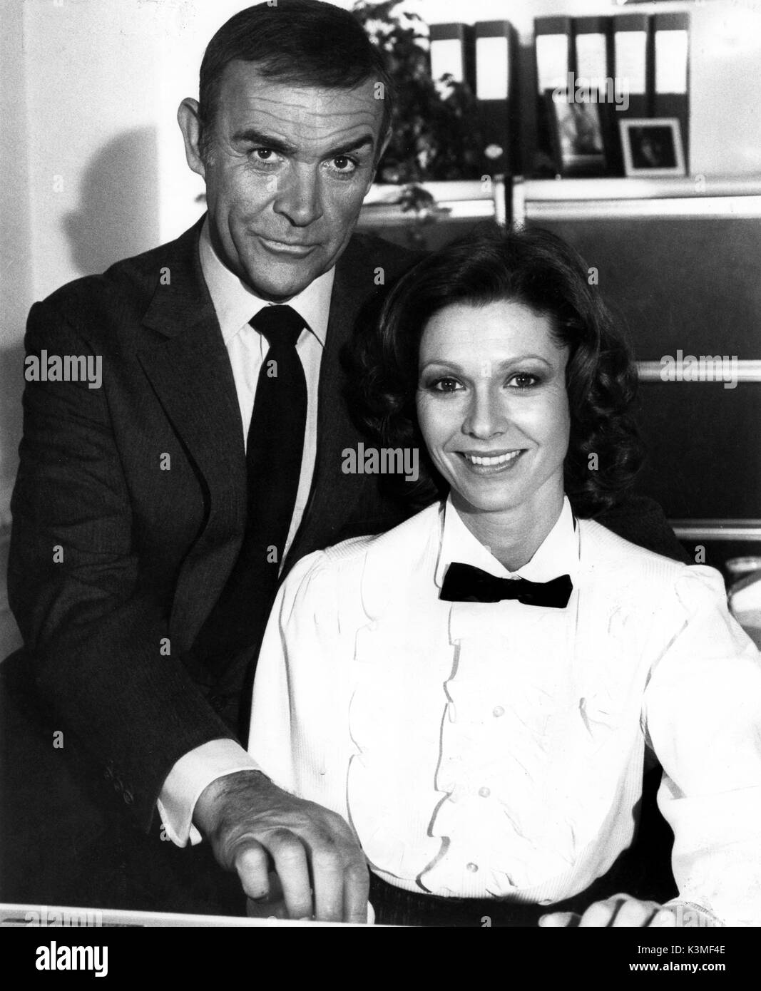 NEVER SAY NEVER AGAIN [BR / US / GER 1983] SEAN CONNERY as James Bond, PAMELA SALEM as Miss Moneypenny     Date: 1983 Stock Photo