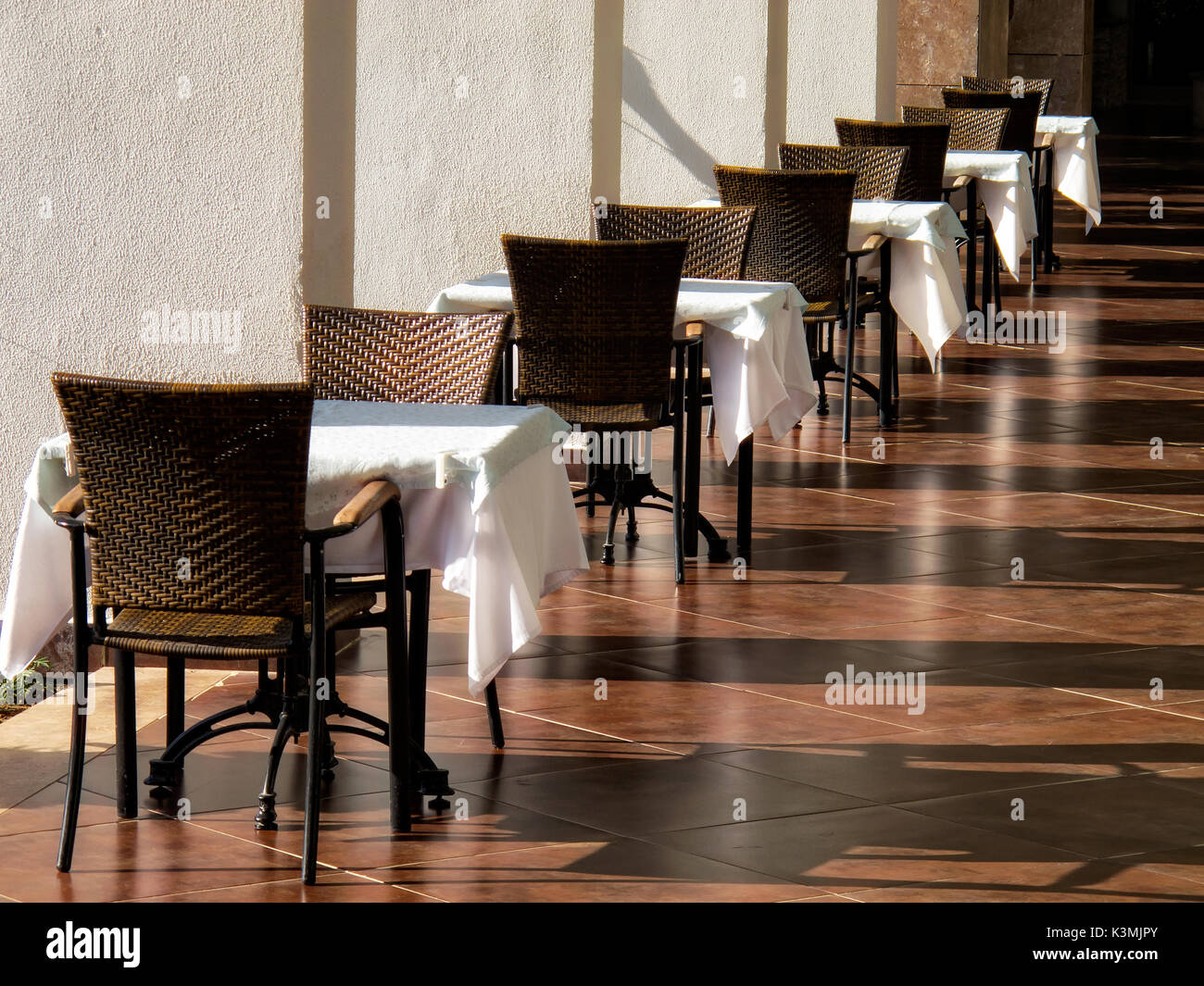 close up shot of outdoor empty restaurant table and chairs. Stock Photo