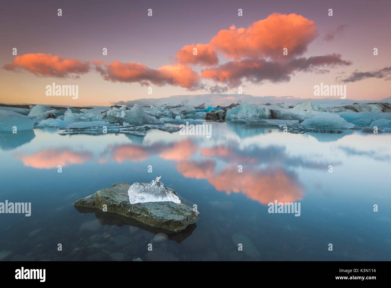 Jokulsarlon, Eastern Iceland, Iceland, Northern Europe. The iconic little icebergs lined on the black sand beach. Stock Photo