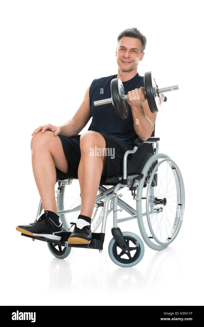 Smiling Disabled Man On Wheelchair Working Out With Dumbbell Over White ...