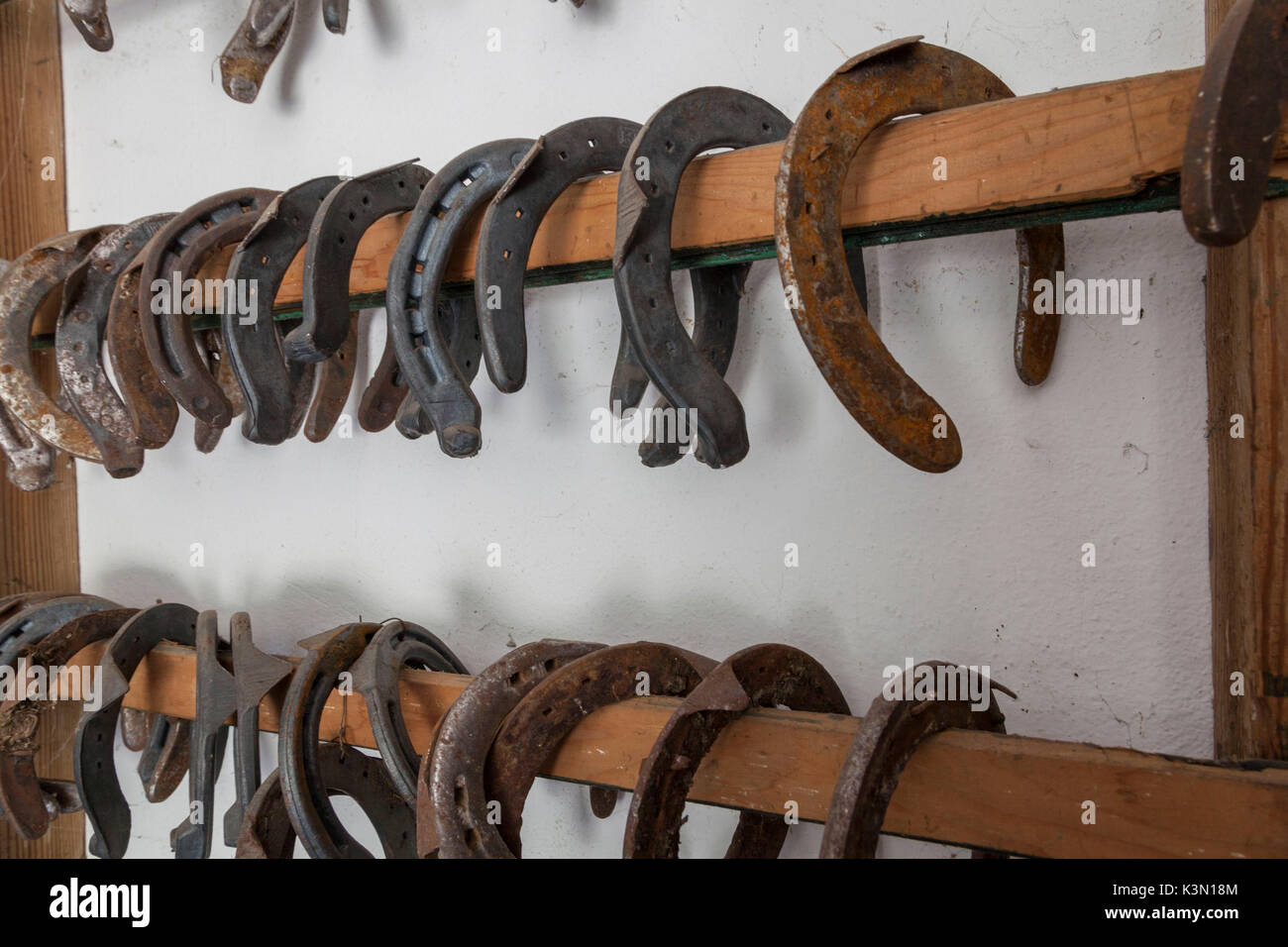 Horseshoes hung on the wall in the stables of the State Forestry Corp center of Selection Equestrian, Salet, Belluno Dolomites National Park, Monti del Sole Stock Photo
