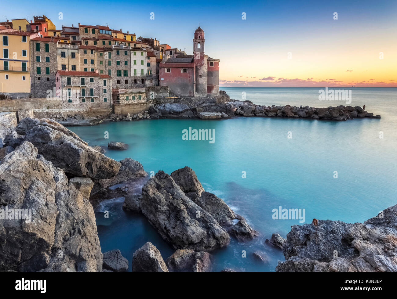 Tellaro town at sunset from it's rocks and little harbour, Lerici, La Spezia gulf, Liguria, Italy. Stock Photo