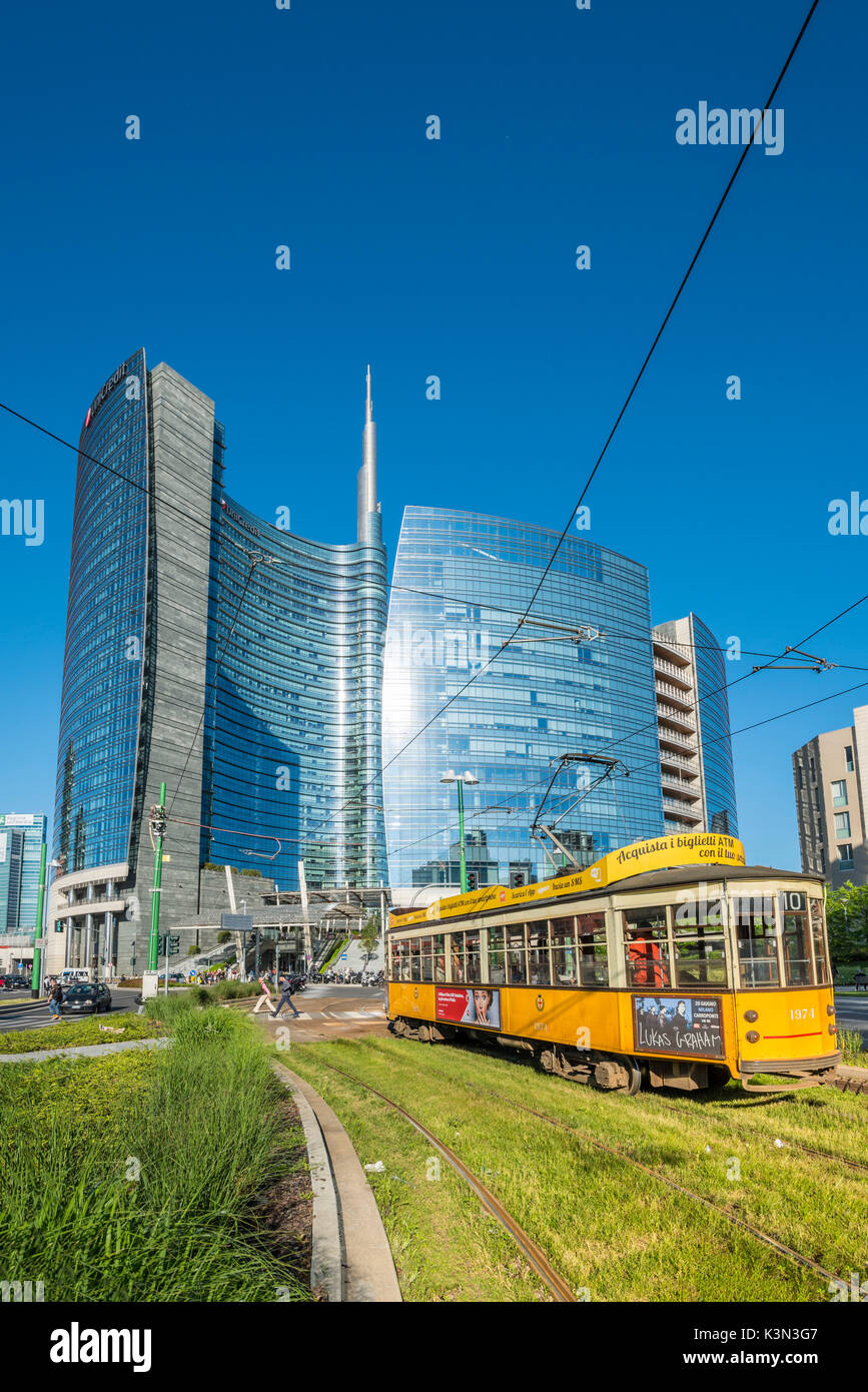 Milan, Lombardy, Italy. Iconic tramway with Porta Nuova business district in the background. Stock Photo
