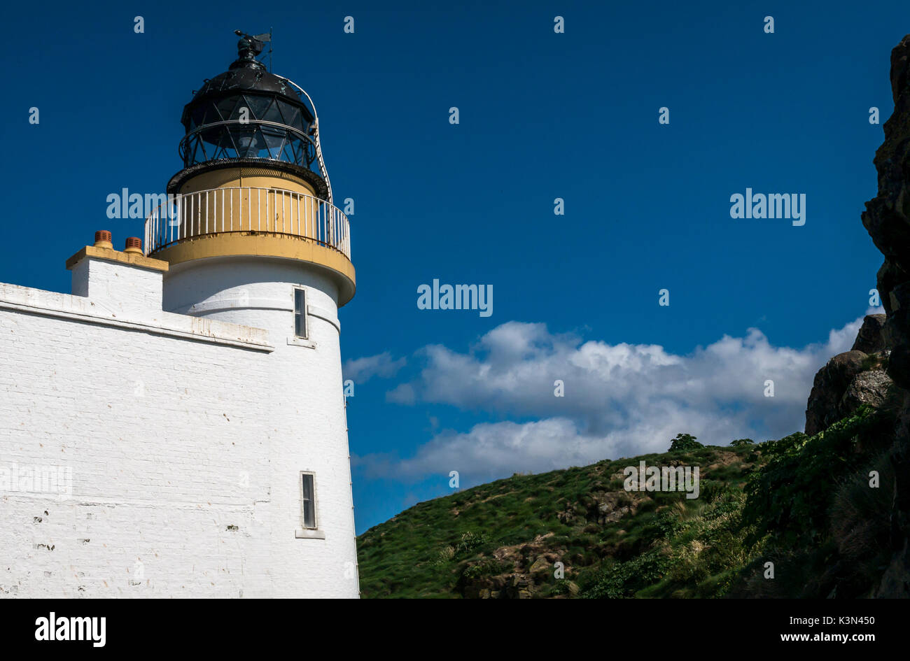 Close up of Stevenson Lighthouse, Fidra Island, Firth of Forth, Scotland, UK, built by the Northern Lighthouse Board, on sunny day with blue sky Stock Photo