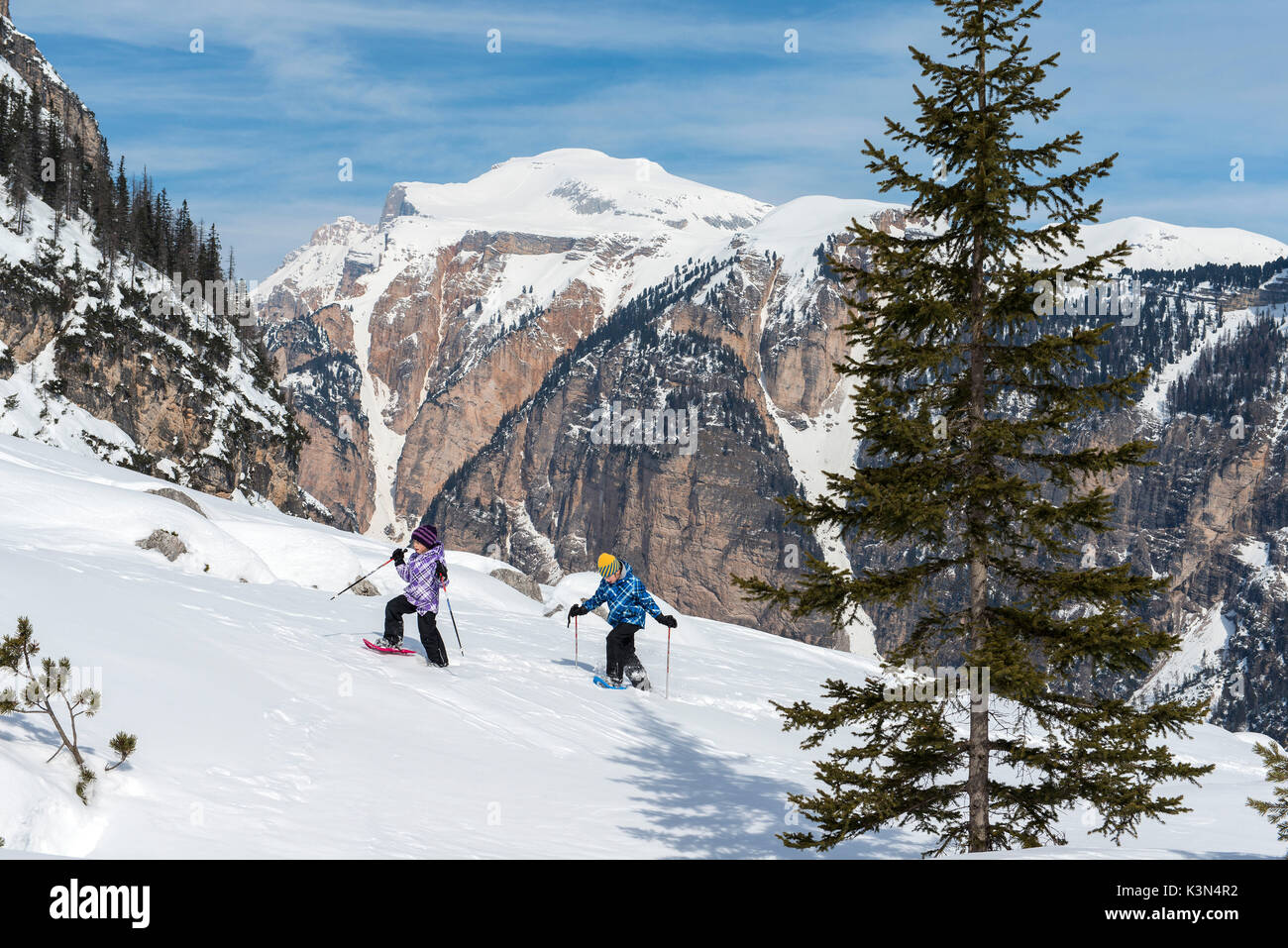 Fanes, Dolomites, South Tyrol, Italy. Children wearing snowshoes walking in the mountains of the Fanes Stock Photo