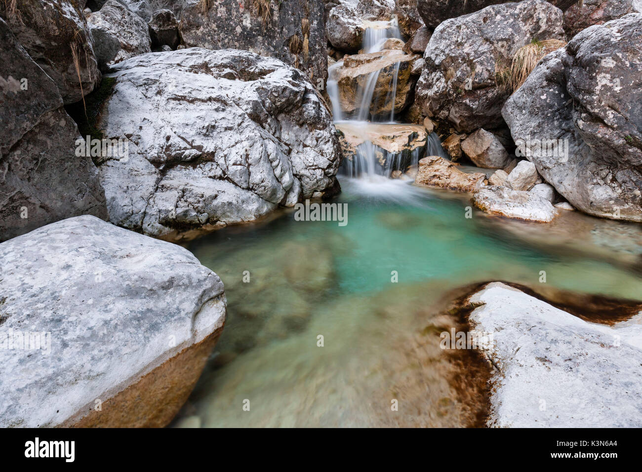 Small waterfalls of turquoise water in val Salet, Monti del Sole, National park Belluno Dolomites, Italy Stock Photo