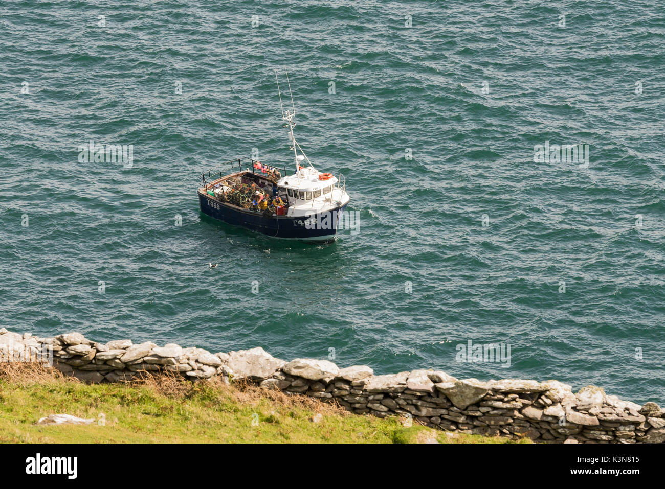 Fishing boat sails in the Irish ocean. Co.Kerry, Ireland, Europe. Stock Photo