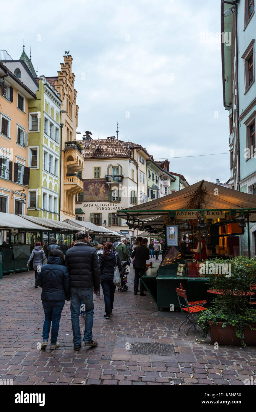 People at the city center fruit and vegetables market. Obstmarkt Square, Bolzano, Trentino Alto Adige - Sudtirol, Italy, Europe. Stock Photo