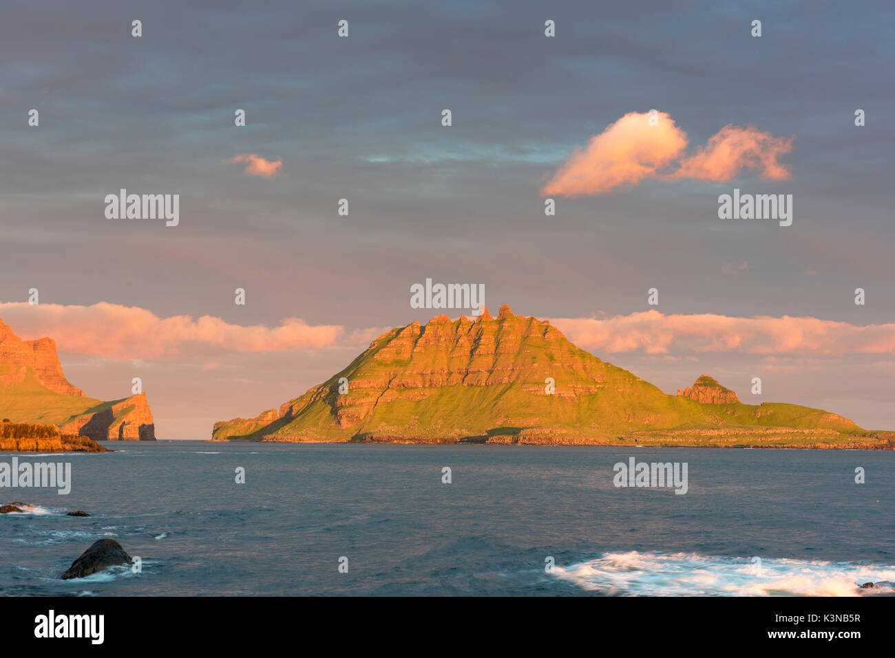 Vagar island, Faroe Islands, Denmark. Sunset over Tindholmur islet. Stock Photo