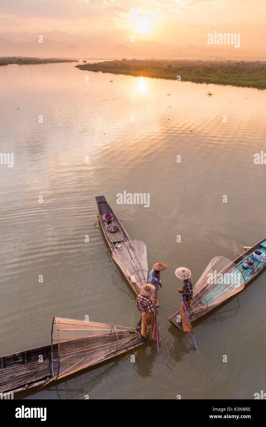 Inle lake, Nyaungshwe township, Taunggyi district, Myanmar (Burma). Thee local fishermen with the conic nets on the boats seen from above. Stock Photo