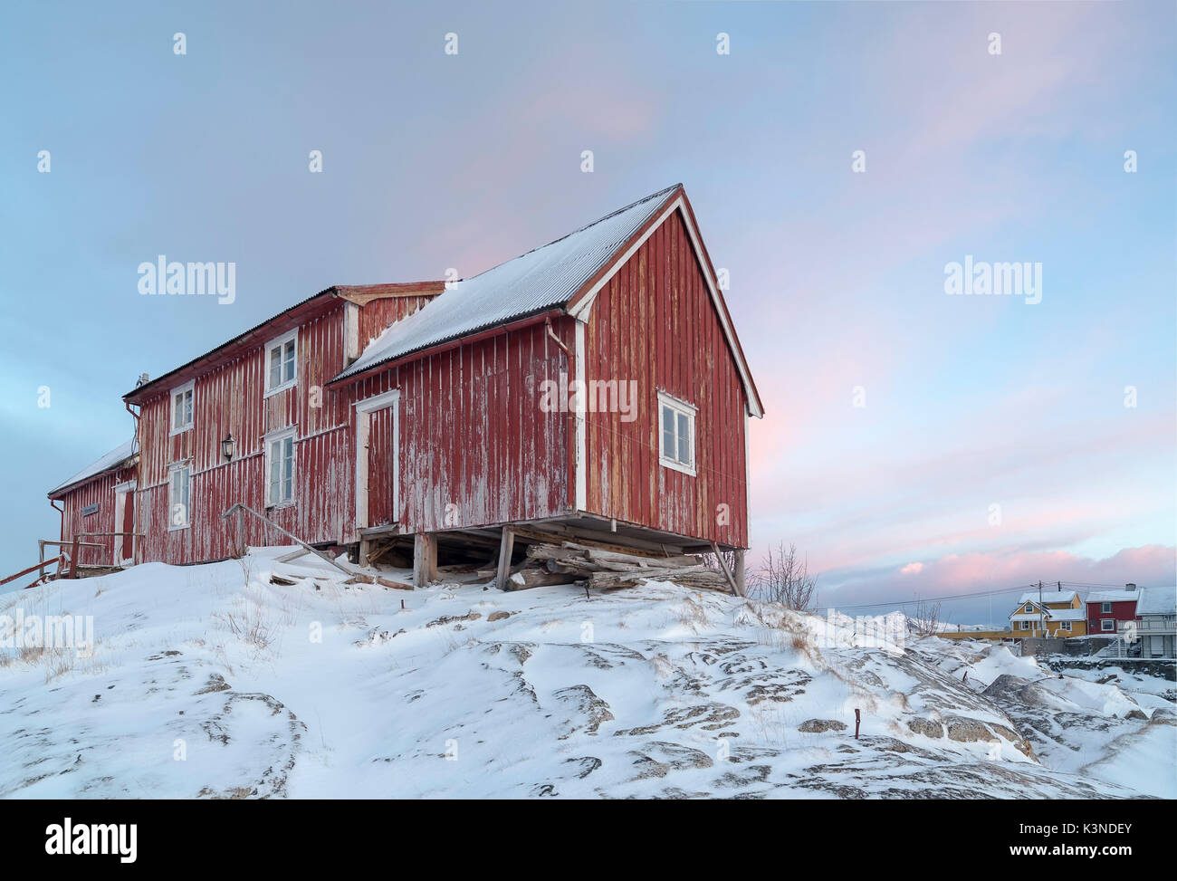 Typical Norwegian Home with colourful sky on the background, Lofoten