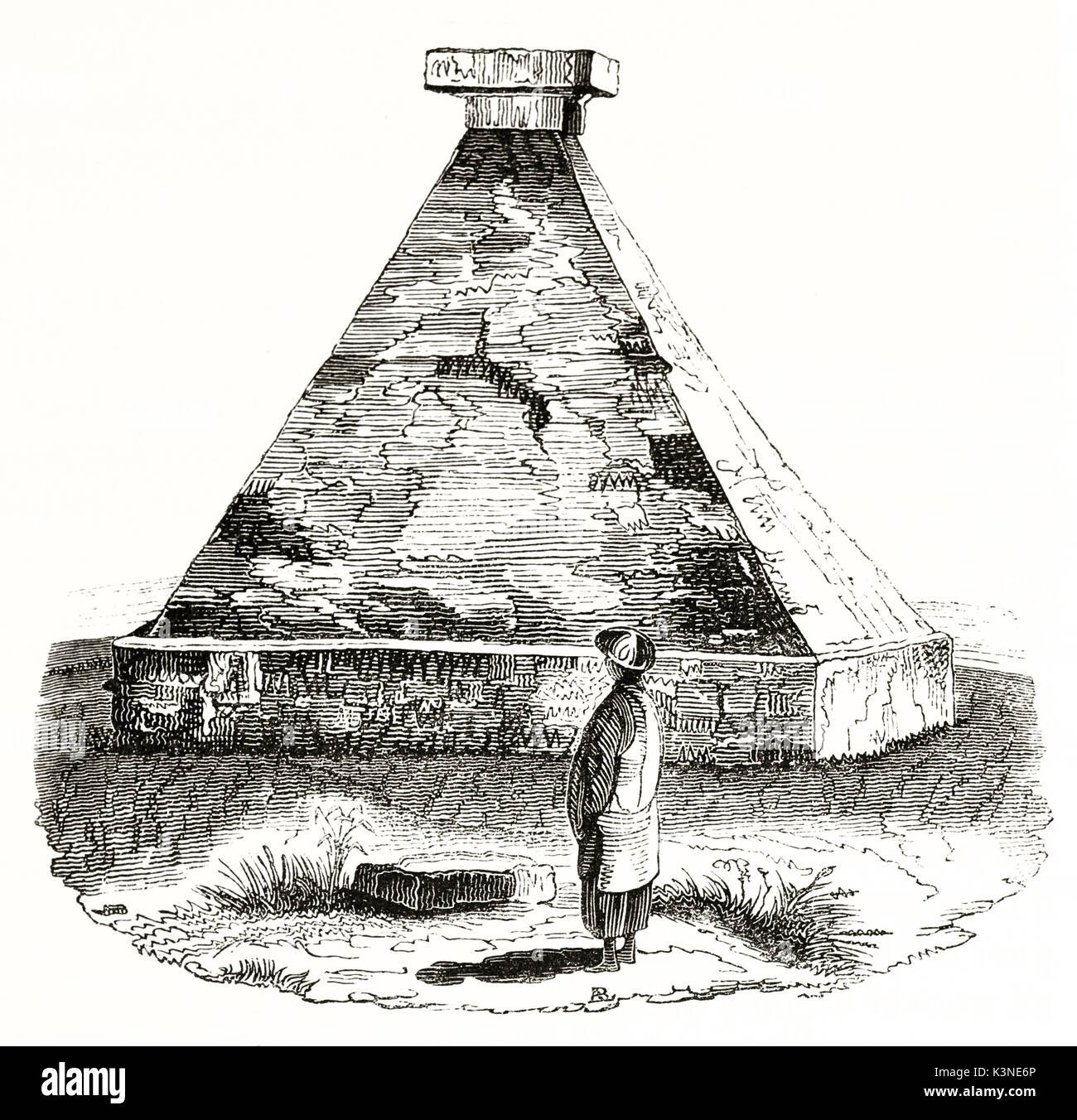 Old illustration of pyramidal Cochinchina stone tomb and a single man looking at it. By unidentified author published on Magasin Pittoresque Paris 1839 Stock Photo