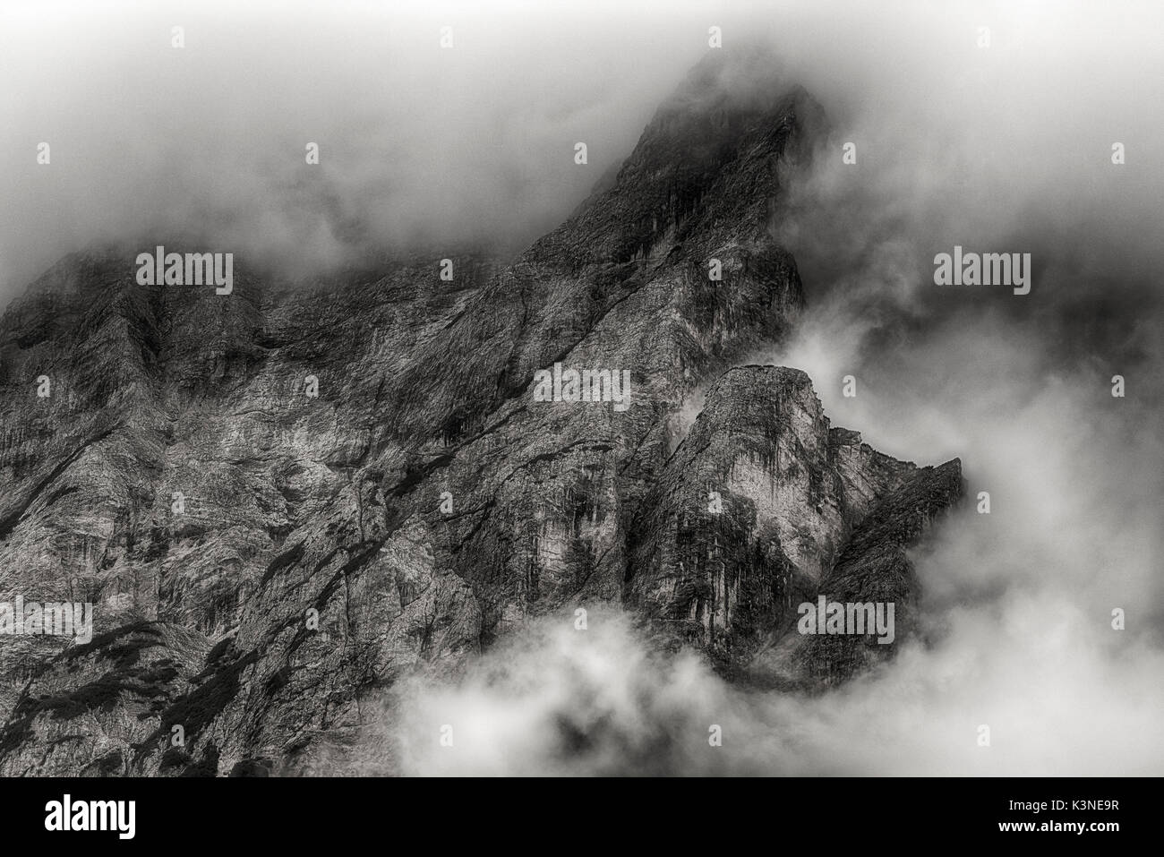 Clouds on the summit of the mountains, dangerous for mountaineers - Trentino-Alto Adige Stock Photo