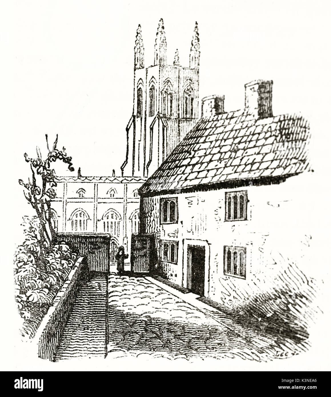 Medieval simple house with a little courtyard on its side and a towerbell on background. John Locke home birth in Wrington Somerset England. published on Magasin Pittoresque Paris 1839 Stock Photo