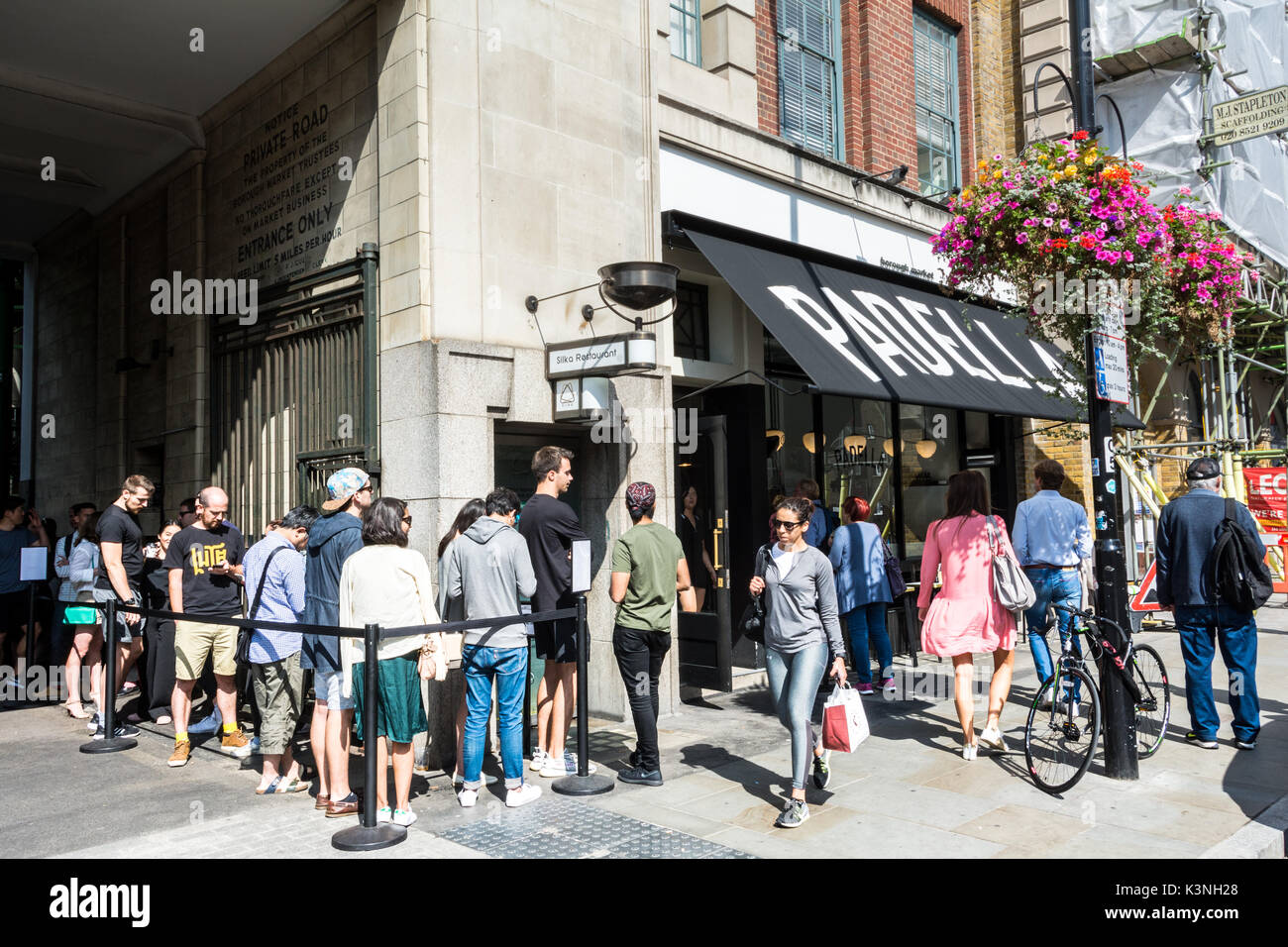Crowds queuing outside Padella, a modern Italian bistro in Borough Market, on Southwark St, London, SE1, UK Stock Photo