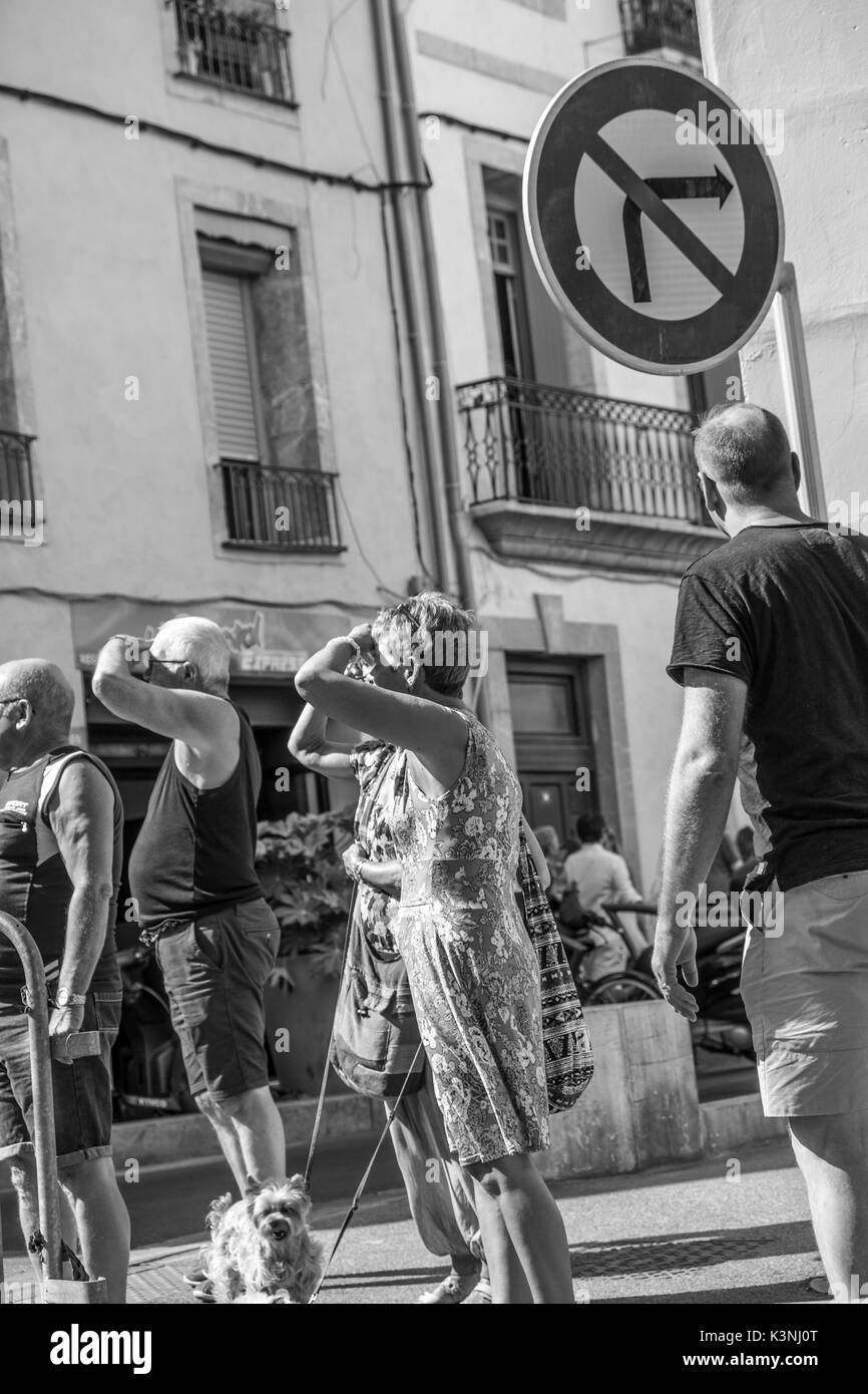 people in street looking up. Stock Photo