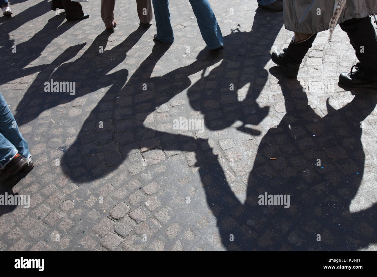 Urban scene of friendship,with shadows in circle, Naples Stock Photo