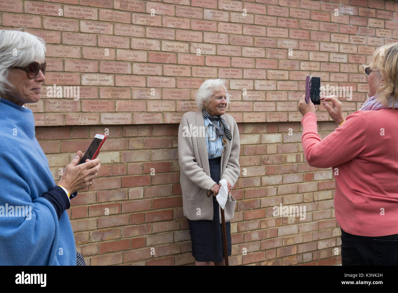 Pauline Burrough stands for a picture under her name on the ...