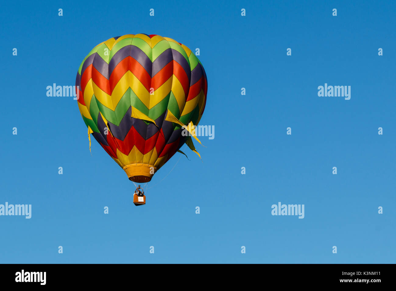 Colorful hot air balloons float through the sky in Albany, Oregon, USA