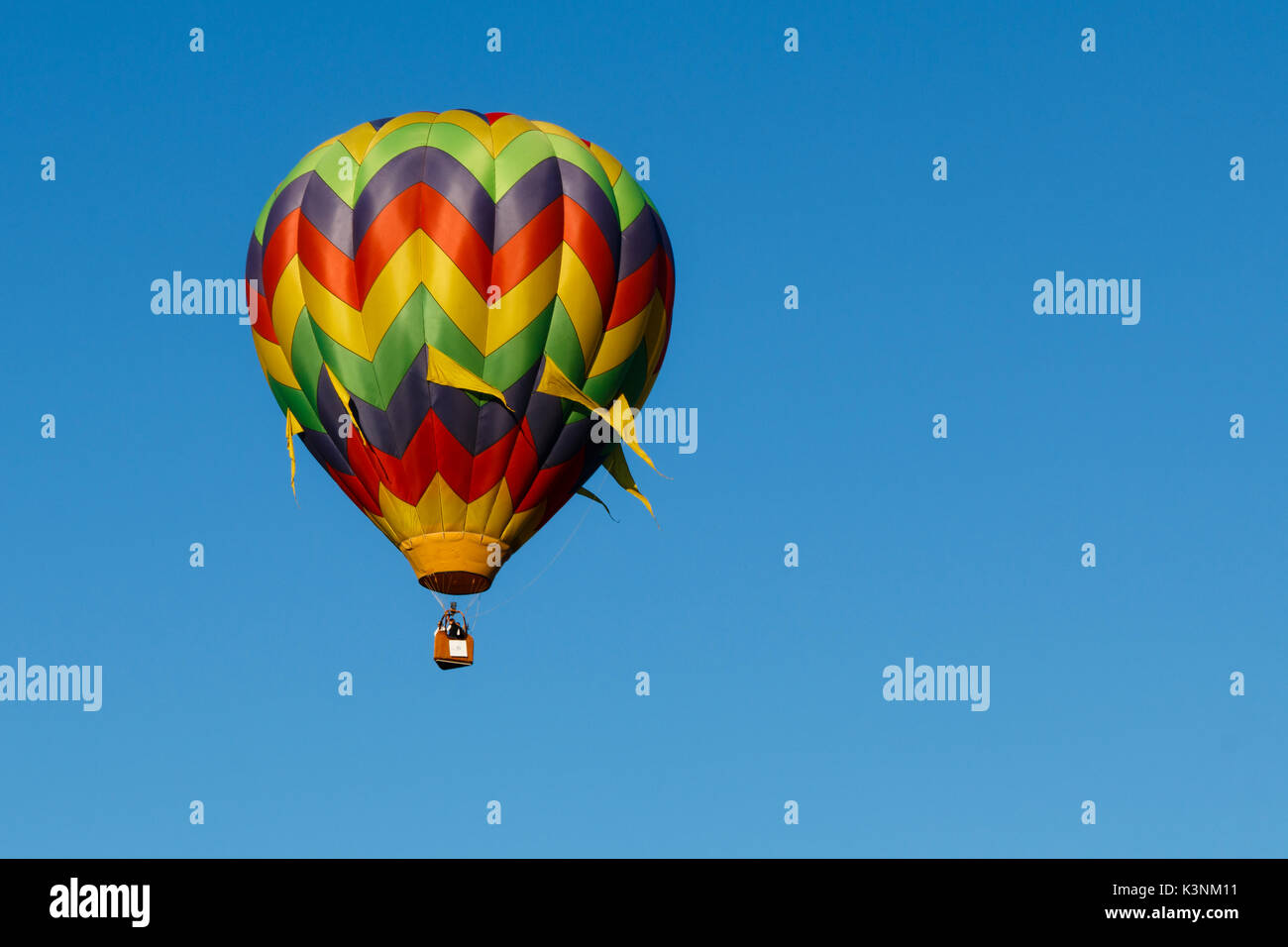 Colorful hot air balloons float through the sky in Albany, Oregon, USA. Stock Photo