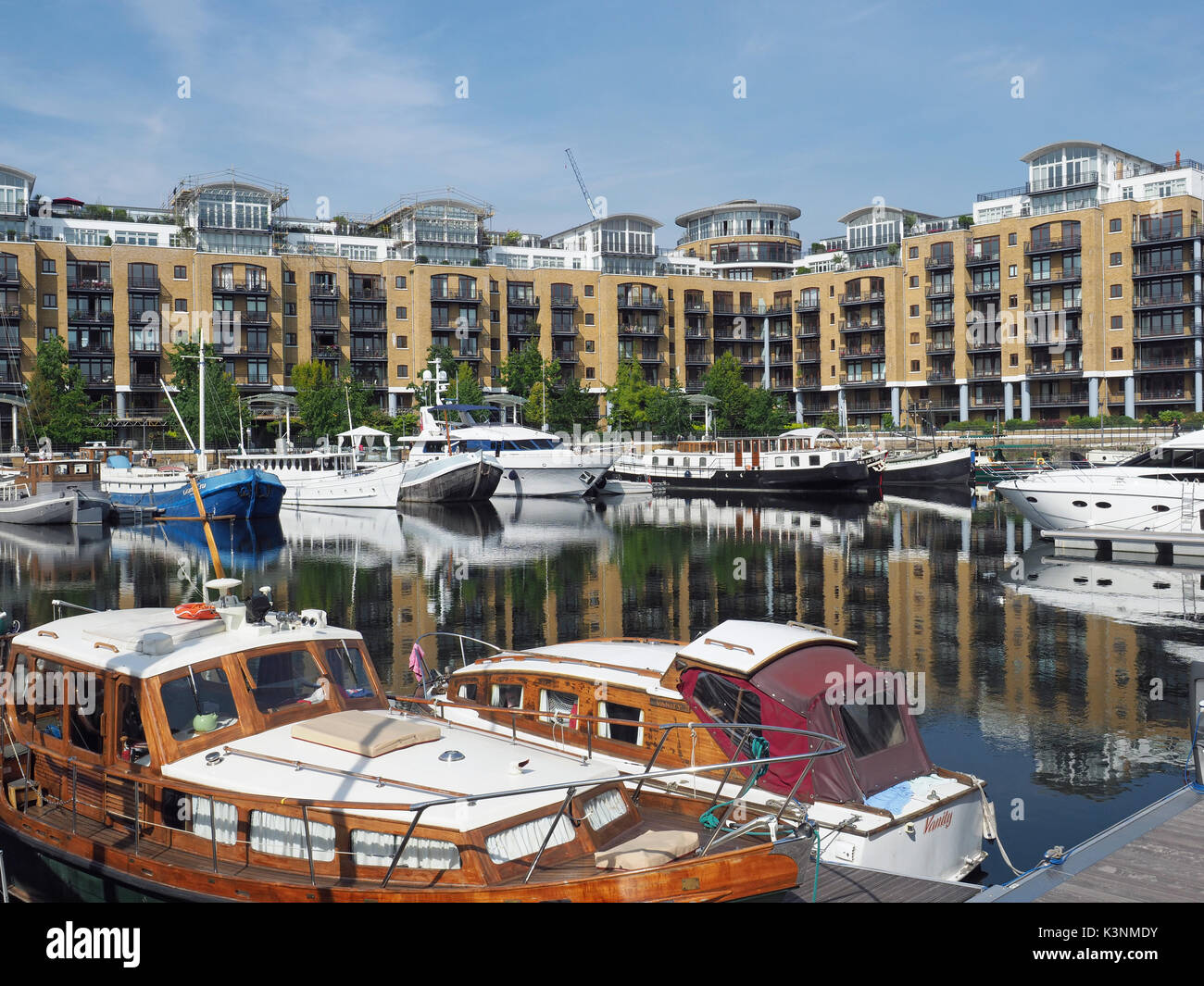 View of boats moored in St Katharine Docks in Central London UK Stock Photo