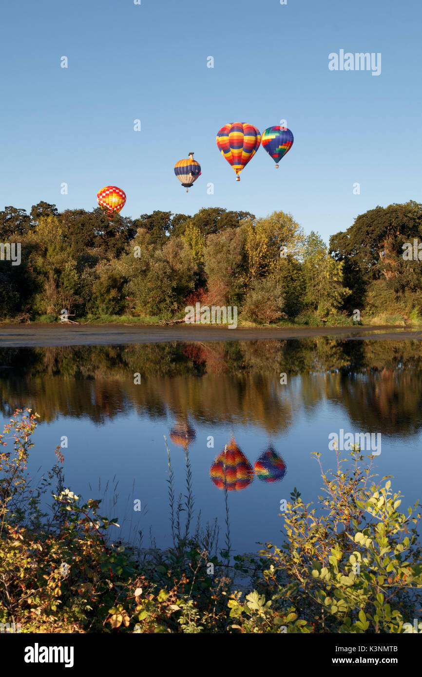 Hot air balloons reflected in lake hi-res stock photography and images