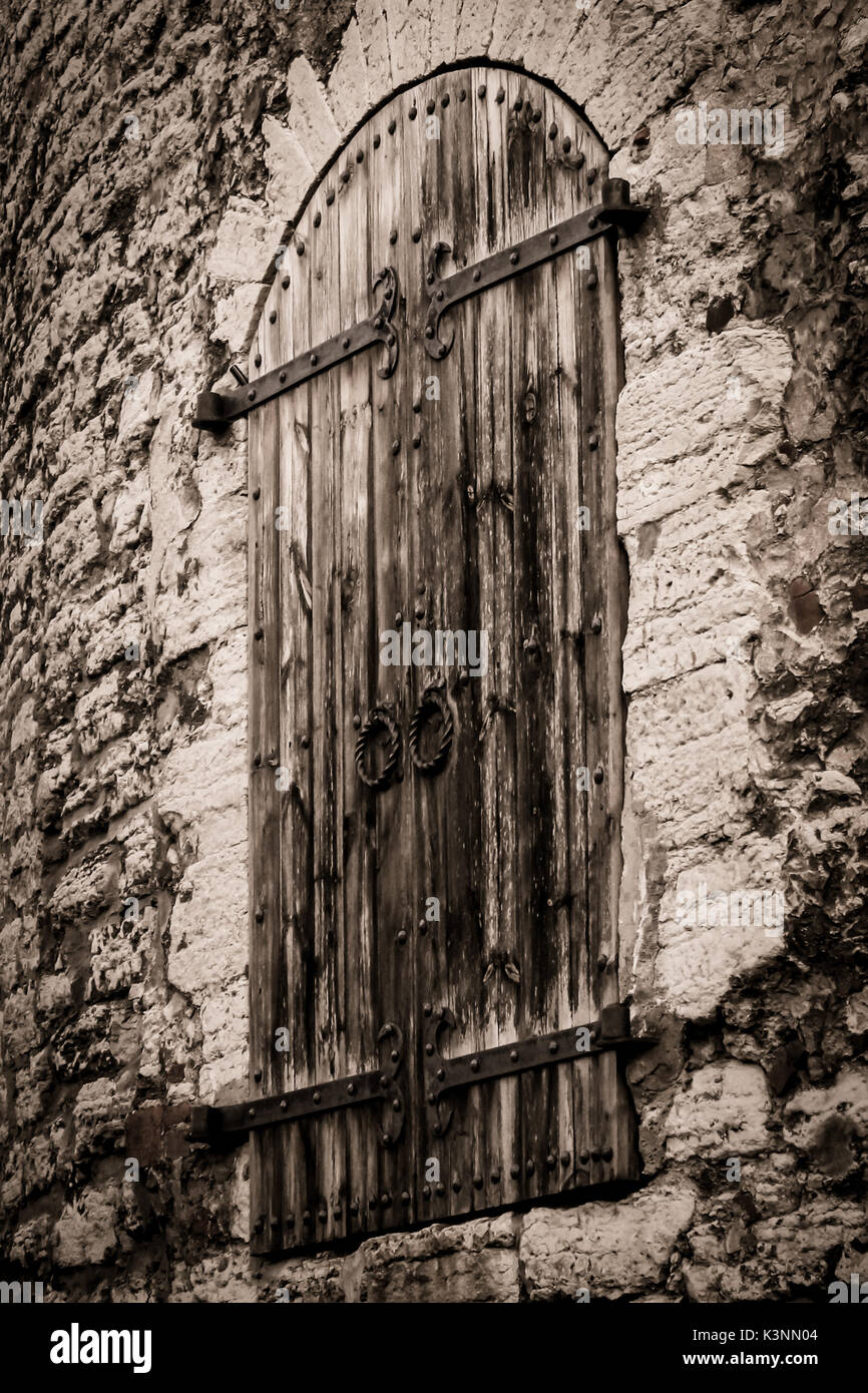 Old wooden door in stone wall Stock Photo - Alamy