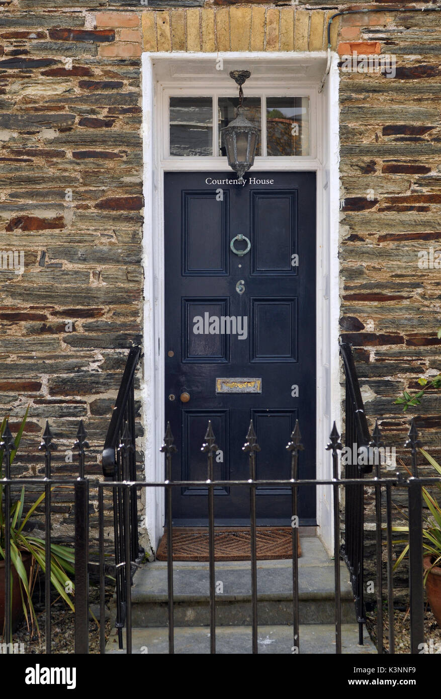 A period door on a Victorian stone and flint built cottage in Cornwall