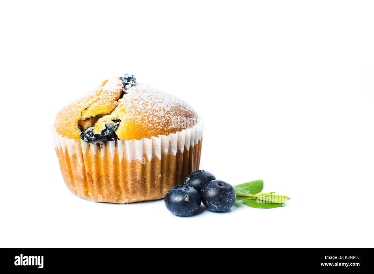 Blueberry muffins in paper holders isolated on white Stock Photo