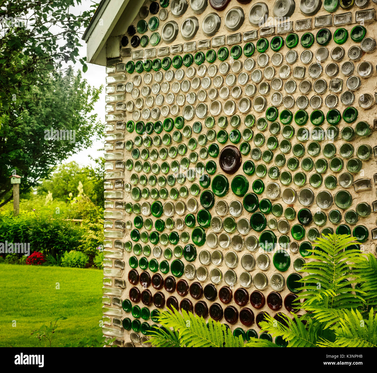 Partial exterior wall of Bottle House. Bottles were used to form the