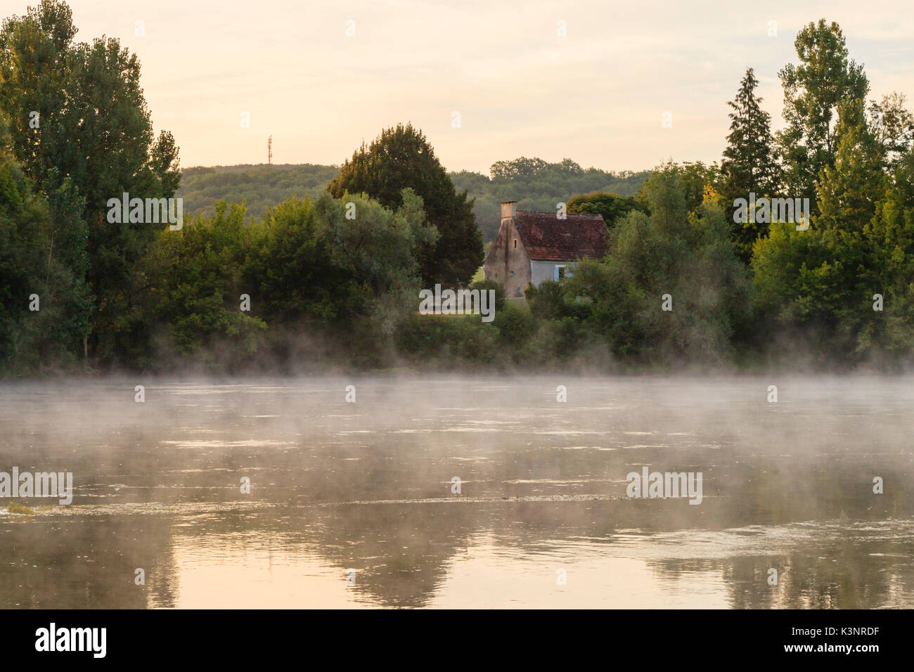 Early morning mist on the Dordogne near Mouzens in Nouvelle Aquitaine, France Stock Photo