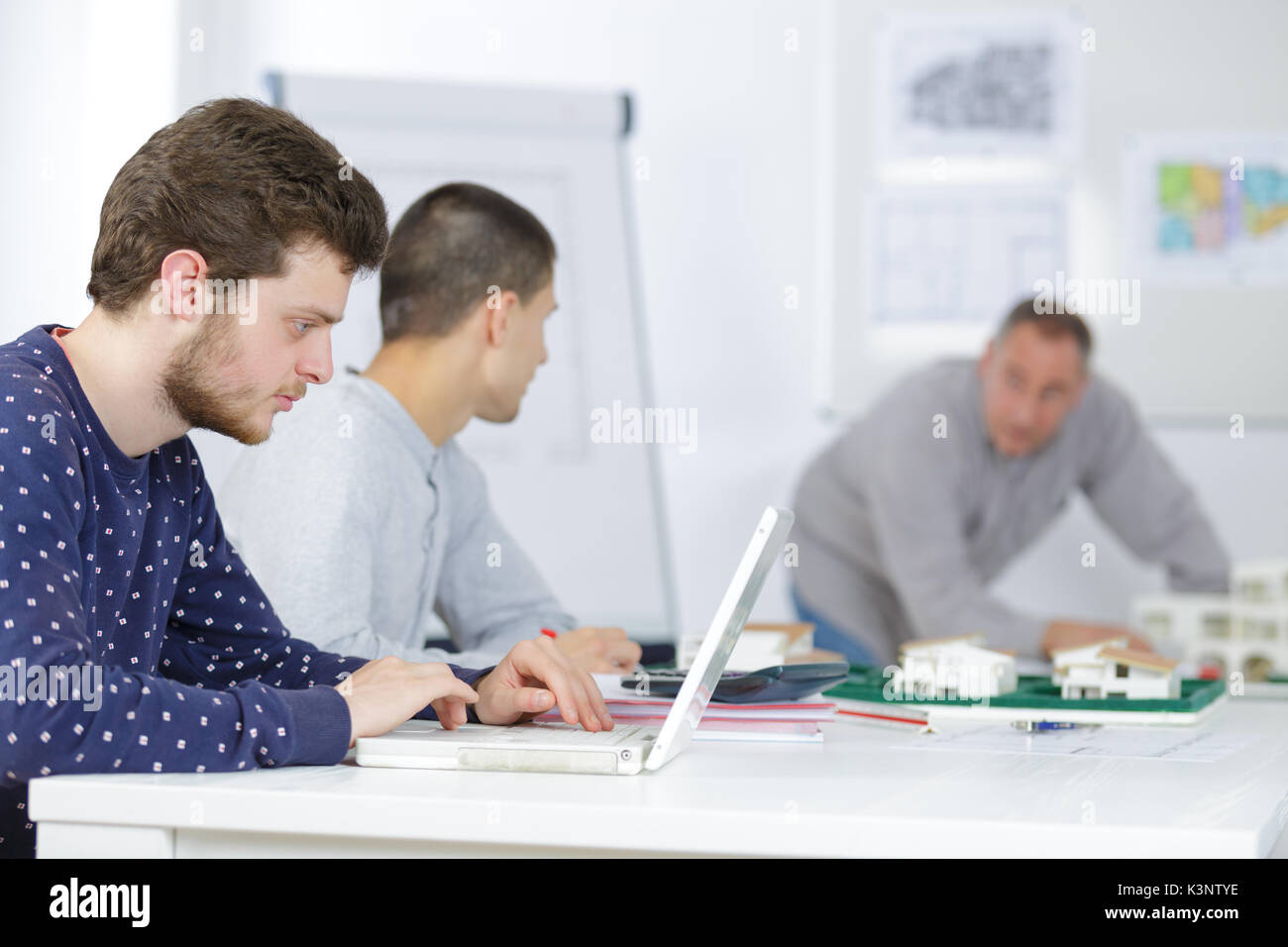 talented young architects watching professional master class Stock Photo