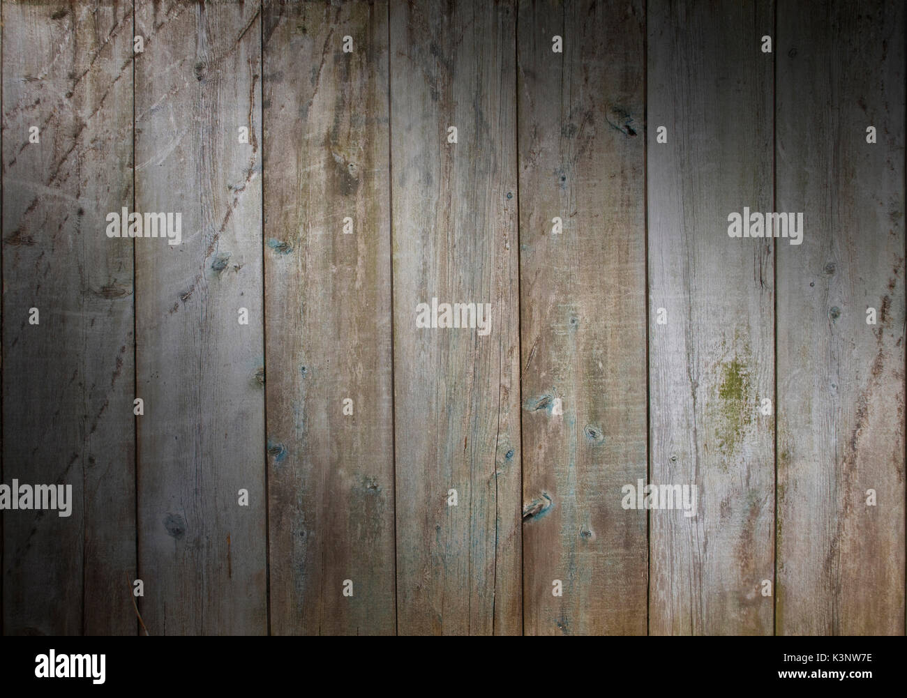 Distressed wooden wall background with weathered boards with scrapes
