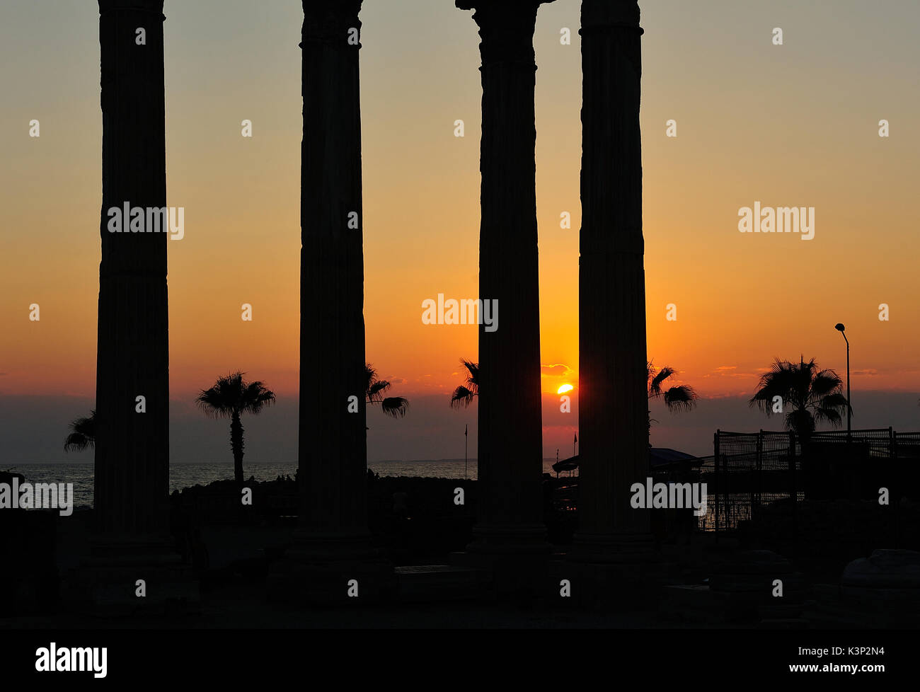 Silhouette of ruins of the Temple of Apollo at sunset Stock Photo